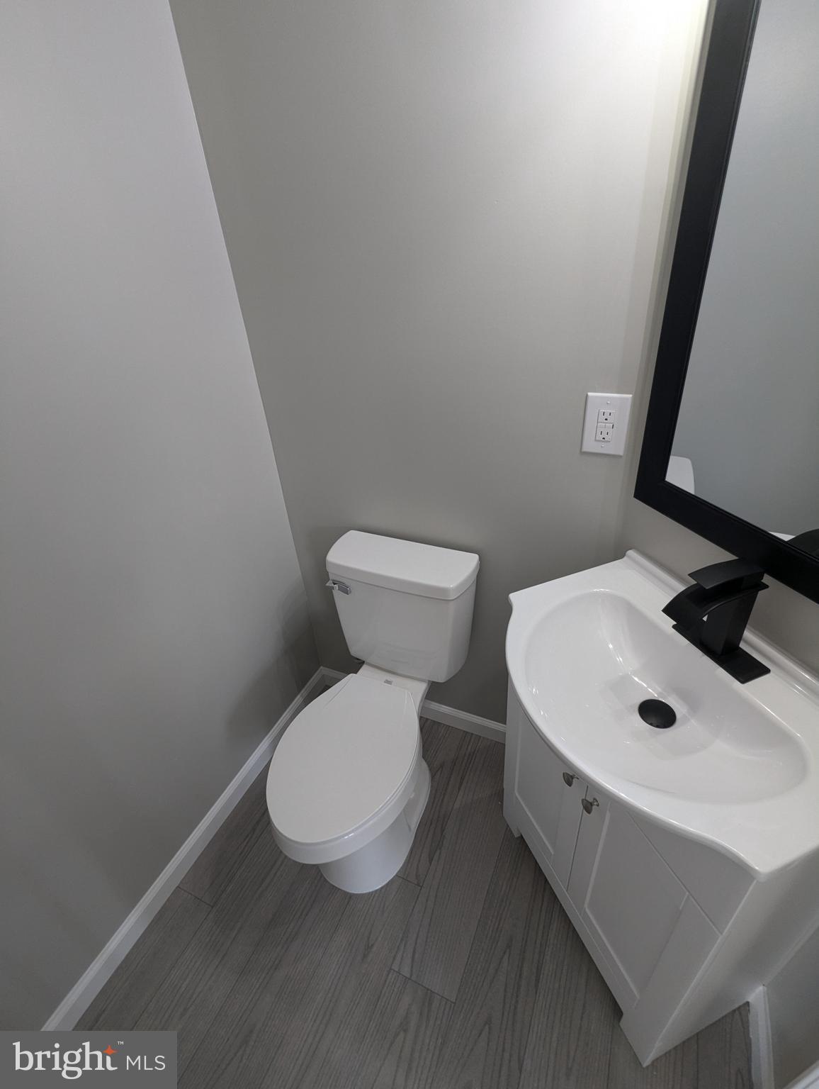 17415 Denali Place Dumfries, VA 22025 - Photo 11 of 55 a white toilet sitting next to a white sink