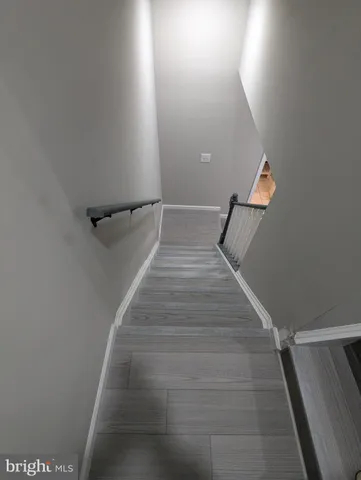 a bathroom with a sink vanity and a mirror
