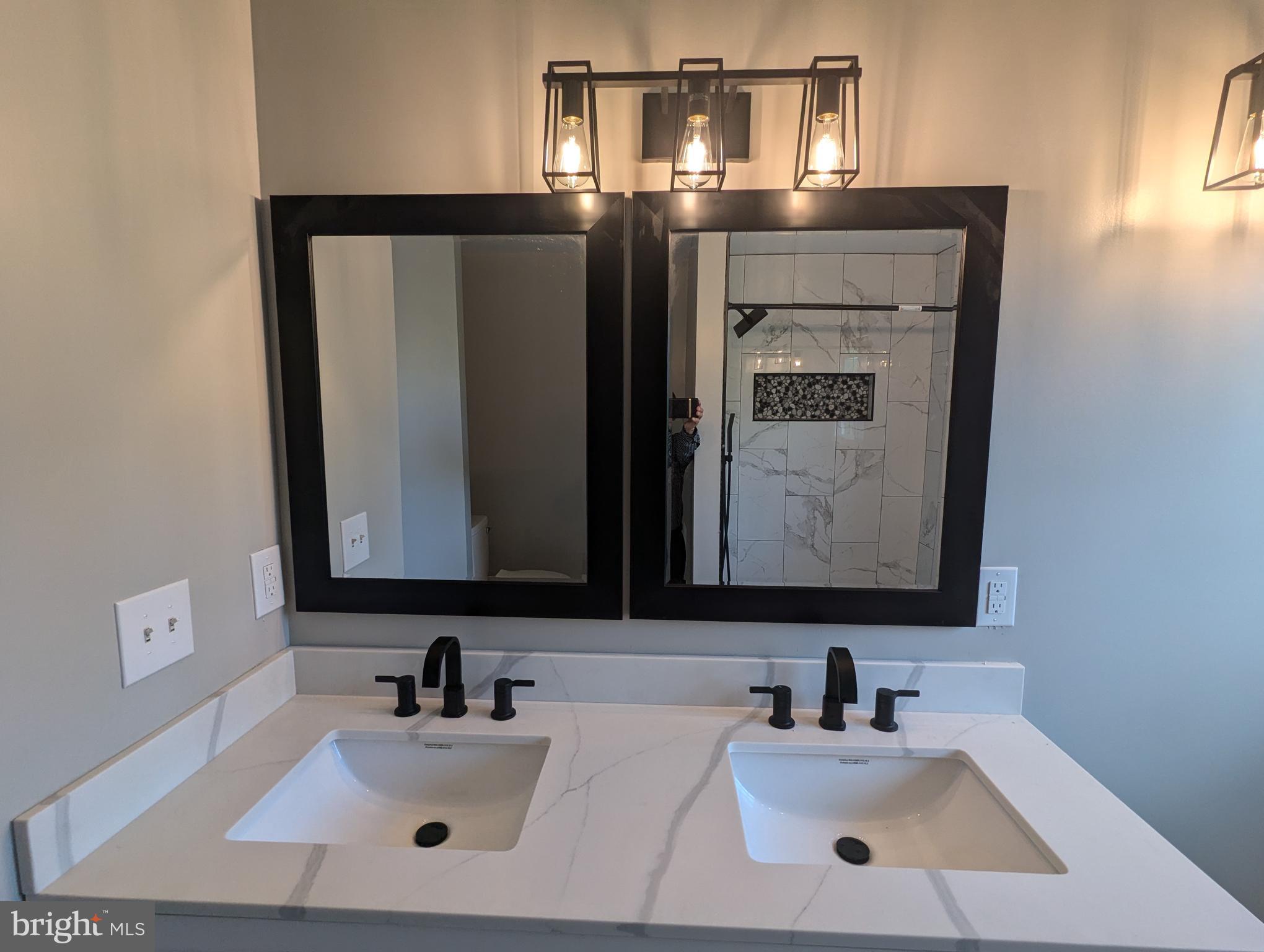 17415 Denali Place Dumfries, VA 22025 - Photo 15 of 55 a bathroom with a sink and a mirror
