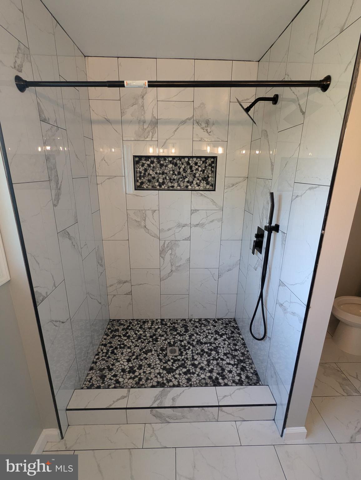 17415 Denali Place Dumfries, VA 22025 - Photo 16 of 55 a bathroom with a shower