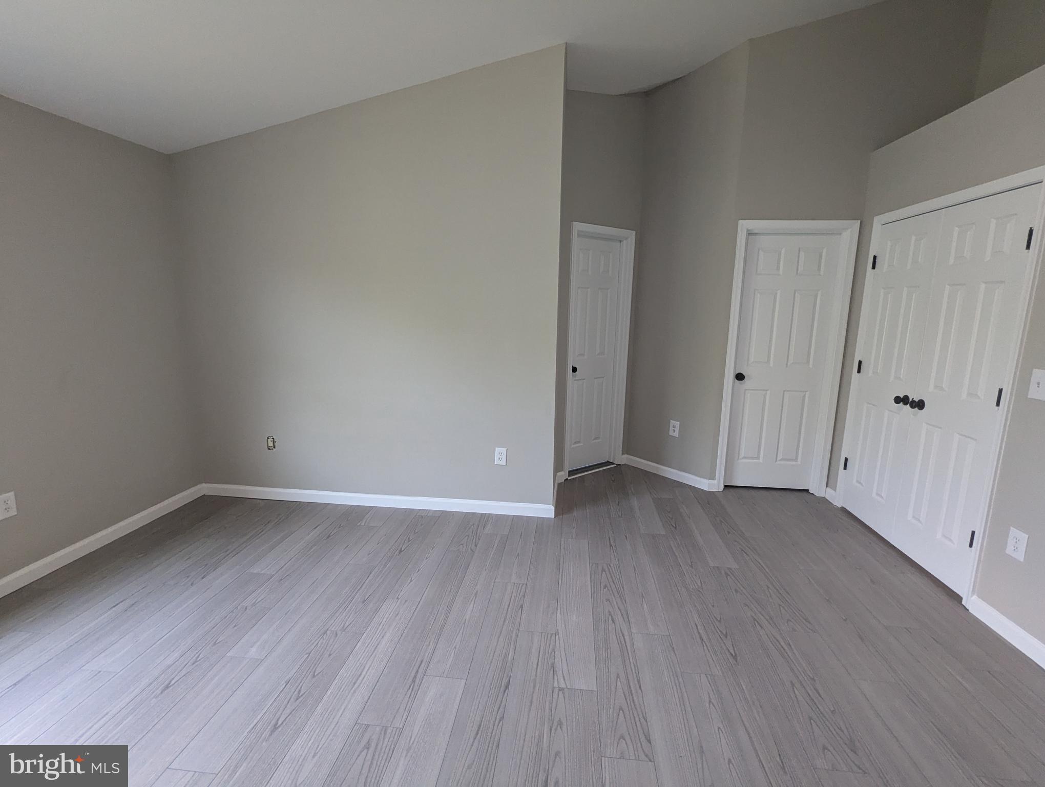 17415 Denali Place Dumfries, VA 22025 - Photo 18 of 55 a view of an empty room with wooden floor