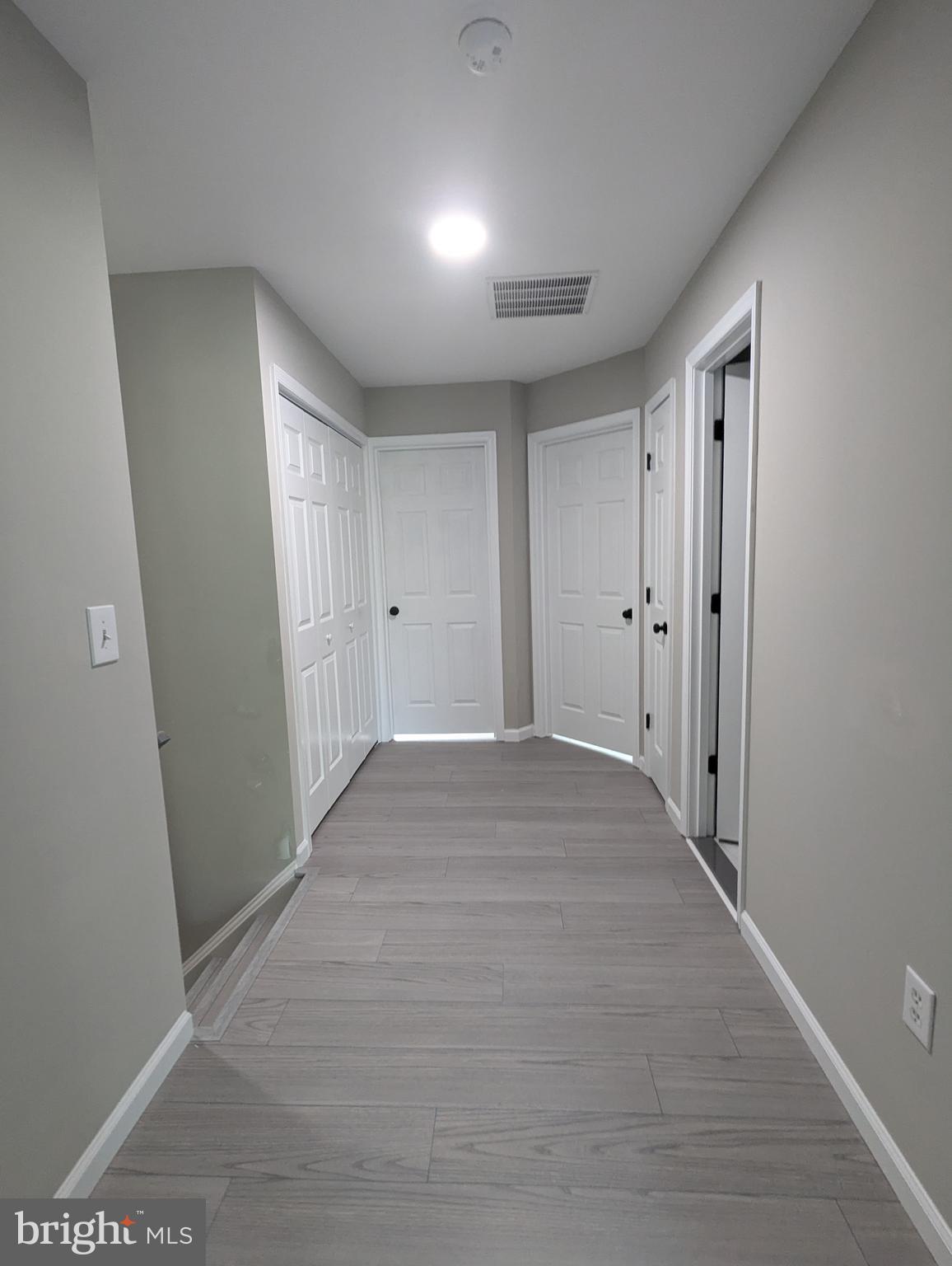 17415 Denali Place Dumfries, VA 22025 - Photo 20 of 55 a view of hallway with wooden floor