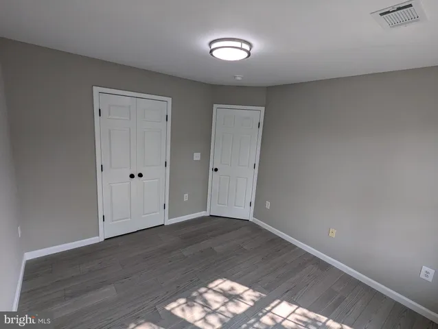 a bathroom with a toilet and a tub