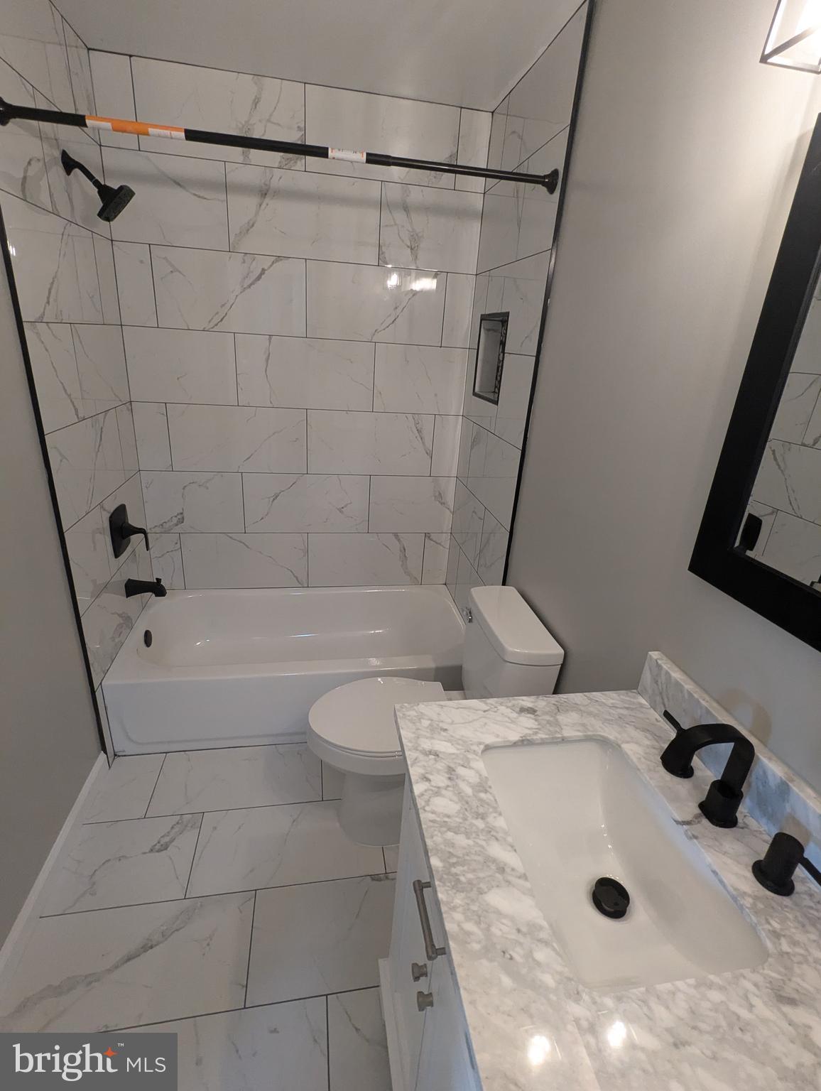 17415 Denali Place Dumfries, VA 22025 - Photo 25 of 55 a bathroom with a tub a sink and glass door