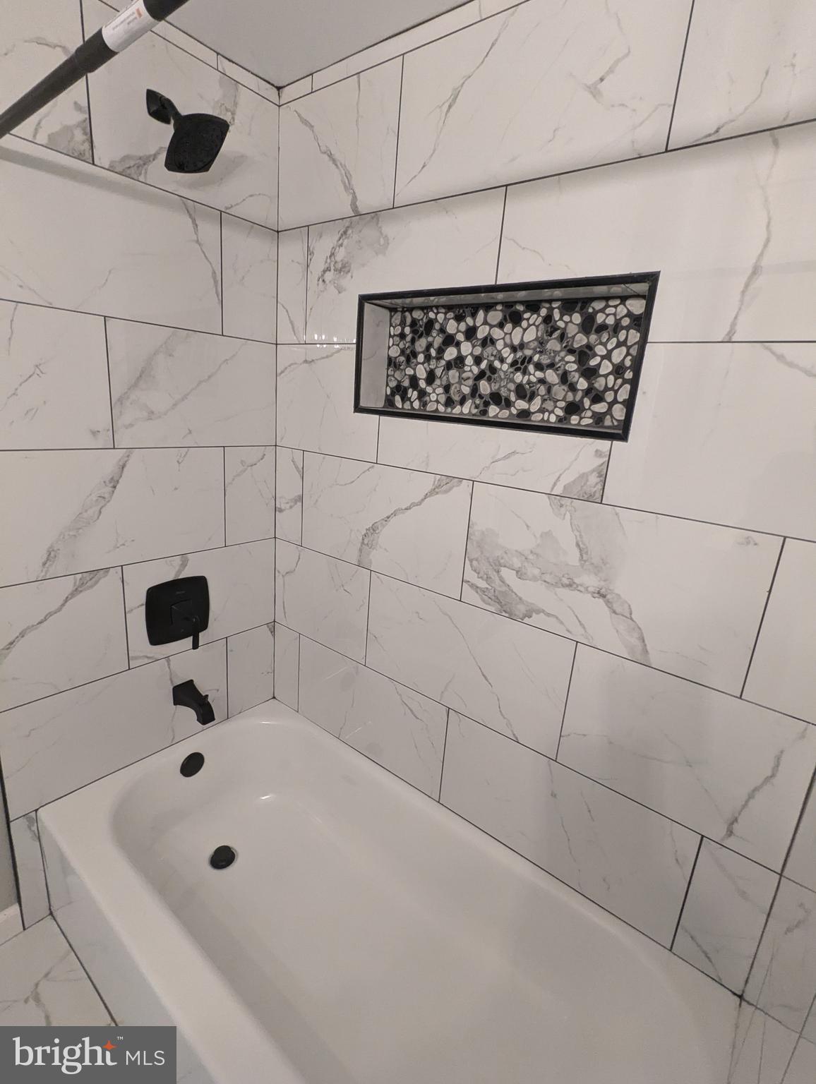 17415 Denali Place Dumfries, VA 22025 - Photo 27 of 55 a bathroom with a bathtub and shower