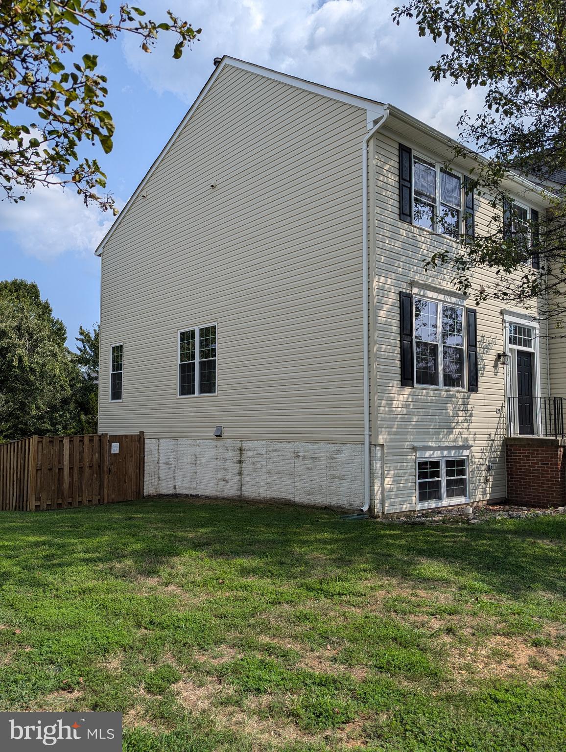 17415 Denali Place Dumfries, VA 22025 - Photo 42 of 55 a view of a house with a yard