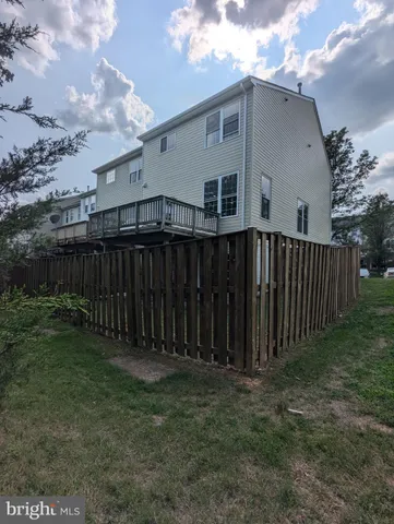 a view of deck in a backyard