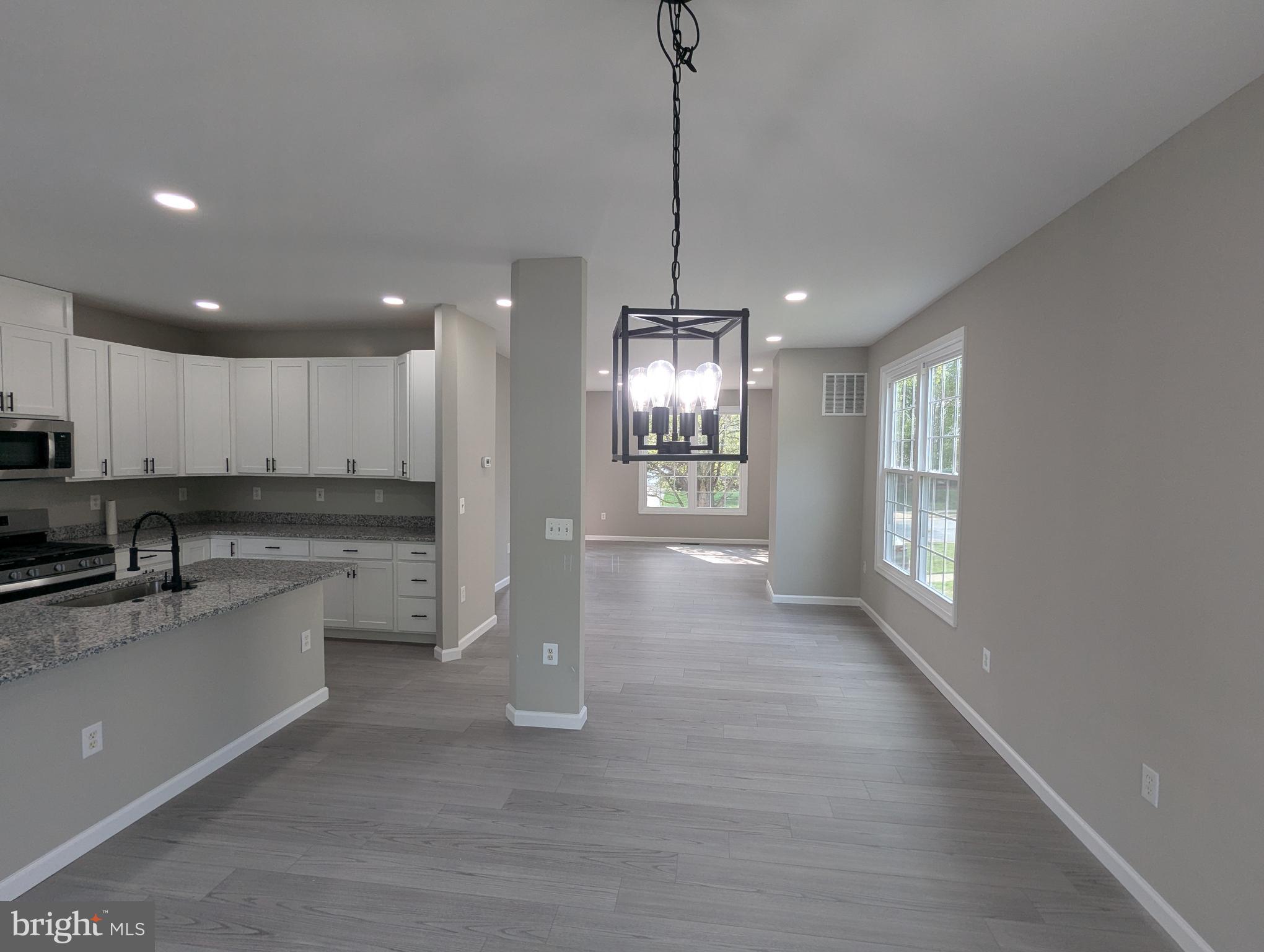 17415 Denali Place Dumfries, VA 22025 - Photo 9 of 55 a view of a kitchen with a sink and microwave