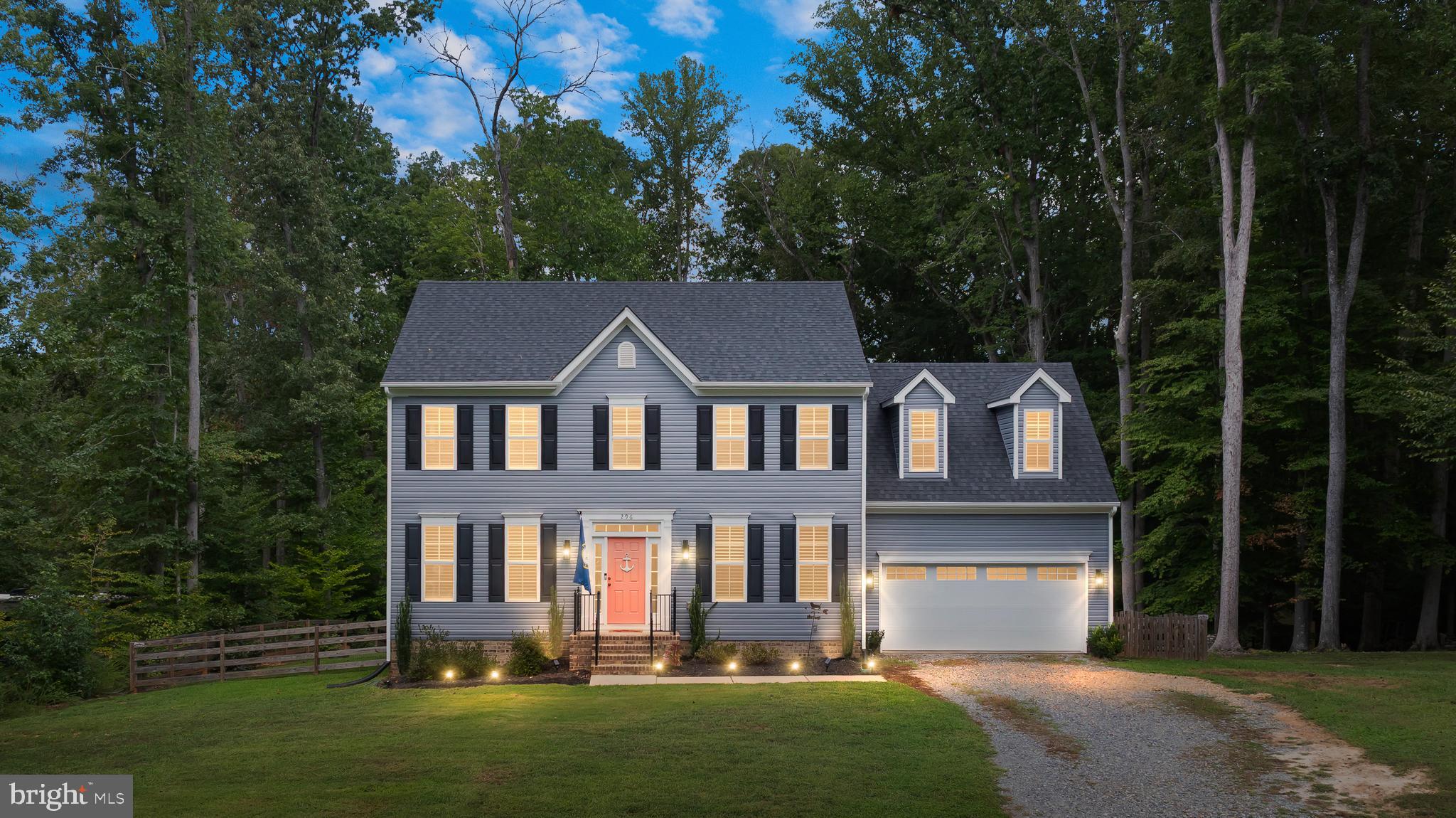 296 Robbie Road Bumpass, VA 23024 - Photo 1 of 1 a front view of a house with a yard and trees