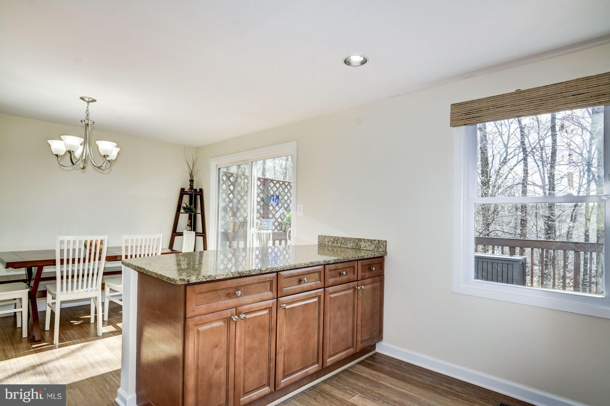 7621 Fallswood Way Lorton, VA 22079 - Photo 11 of 26 a view of a dining room with furniture window and outside view