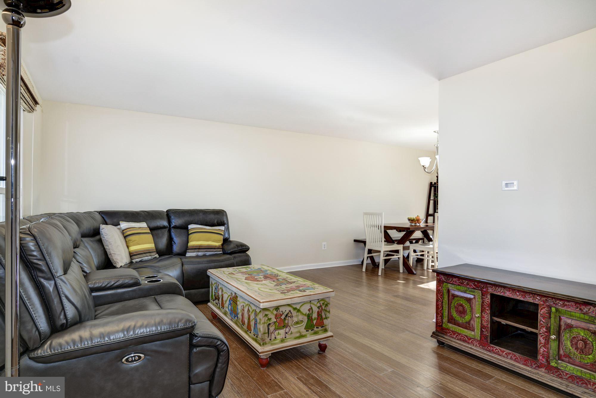 7621 Fallswood Way Lorton, VA 22079 - Photo 3 of 26 a living room with furniture and a wooden floor