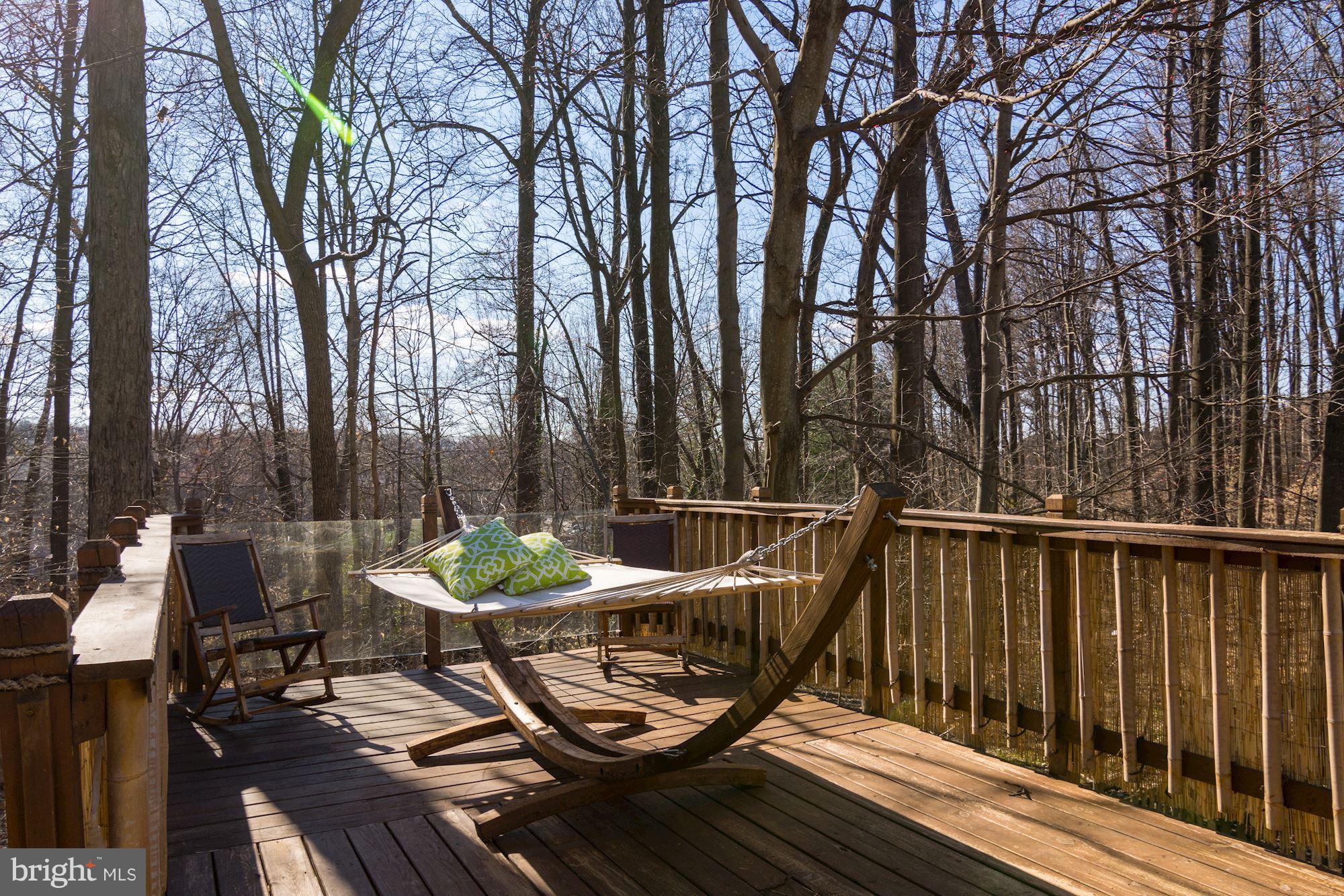 7621 Fallswood Way Lorton, VA 22079 - Photo 23 of 26 a view of a chairs and table on the deck
