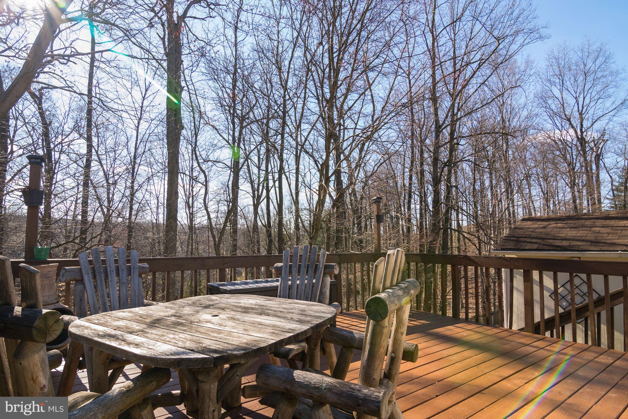 7621 Fallswood Way Lorton, VA 22079 - Photo 24 of 26 a view of a dinning table and chairs on the roof deck