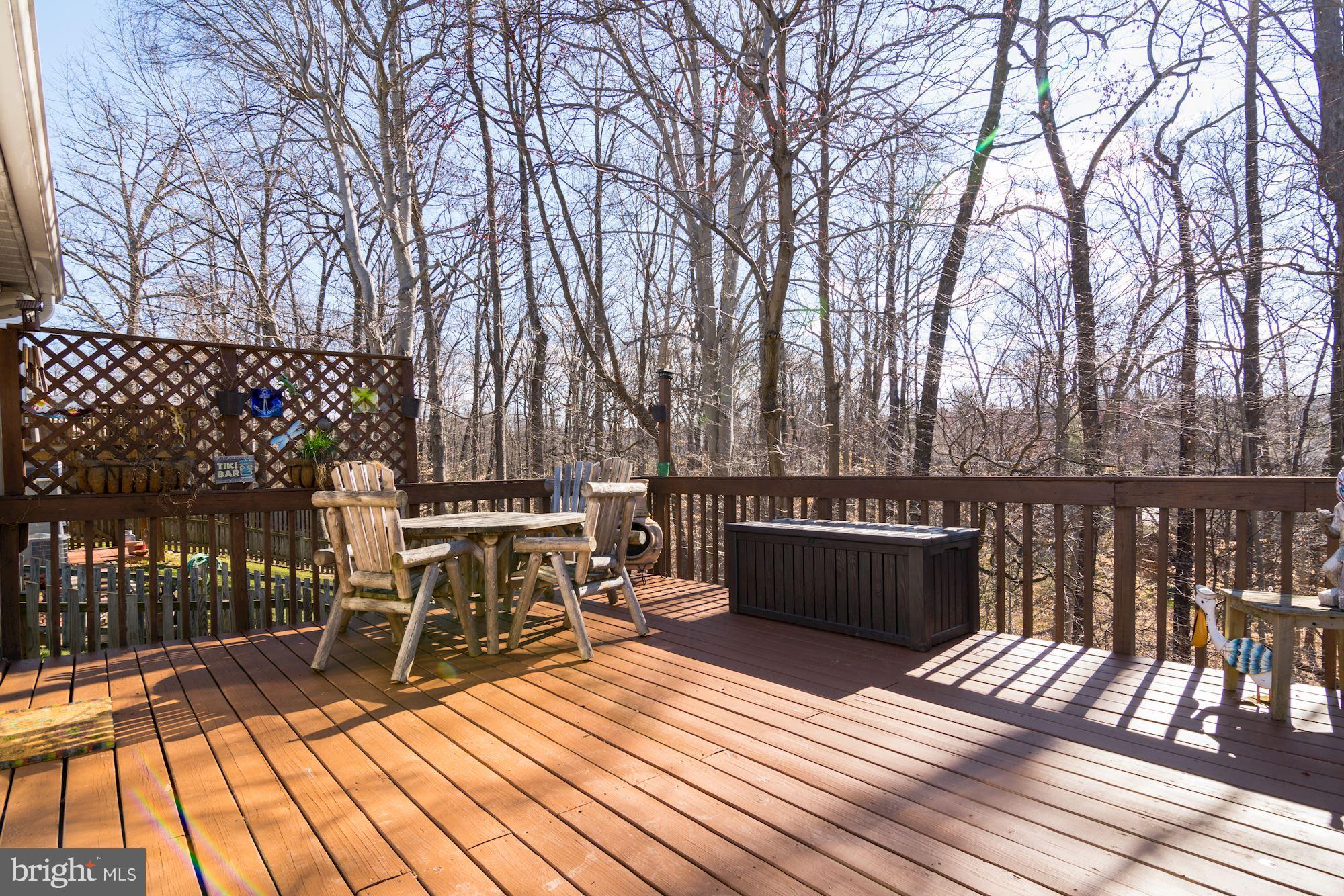 7621 Fallswood Way Lorton, VA 22079 - Photo 25 of 26 a view of balcony with wooden floor and outdoor seating