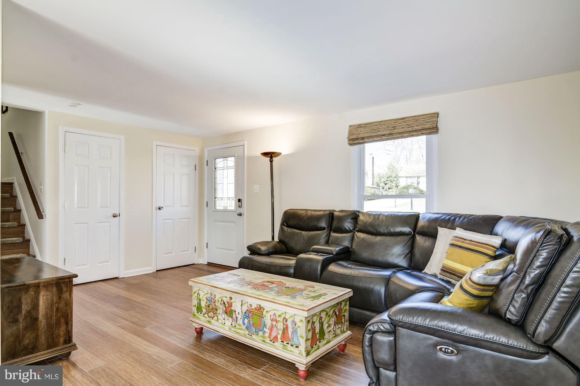 7621 Fallswood Way Lorton, VA 22079 - Photo 5 of 26 a living room with furniture and a window