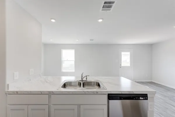 a kitchen with a sink and cabinets