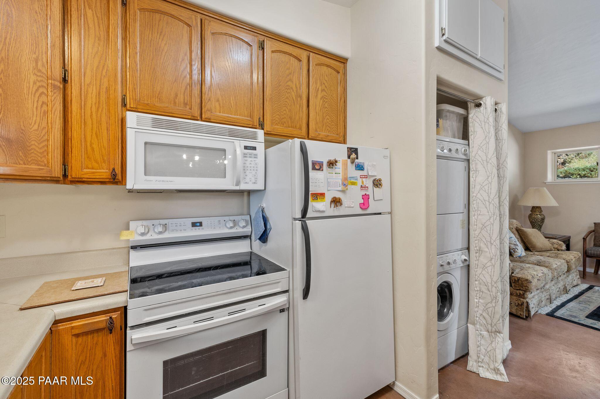 277 Jacob Lane Prescott, AZ 86303 - Photo 12 of 38 a utility room with fridge dryer and washer