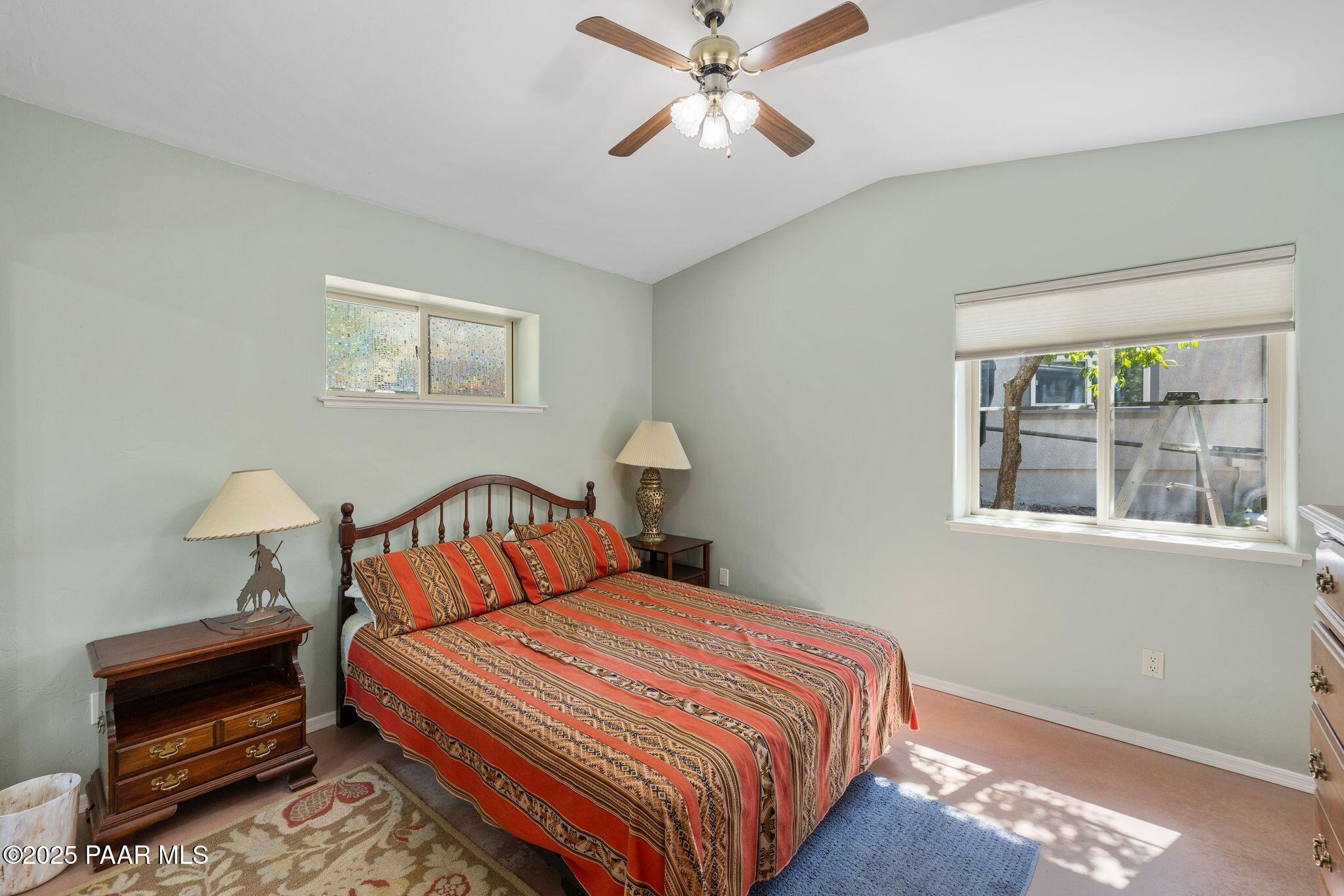 277 Jacob Lane Prescott, AZ 86303 - Photo 16 of 38 a bedroom with bed and a window