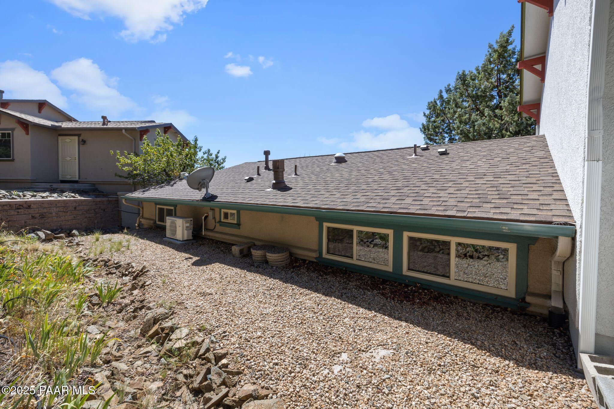 277 Jacob Lane Prescott, AZ 86303 - Photo 21 of 38 a backyard of a house with a table and chairs