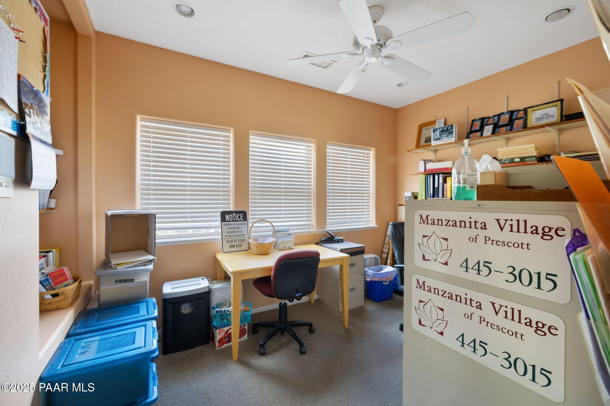 277 Jacob Lane Prescott, AZ 86303 - Photo 33 of 38 a view of a workspace with furniture and a window