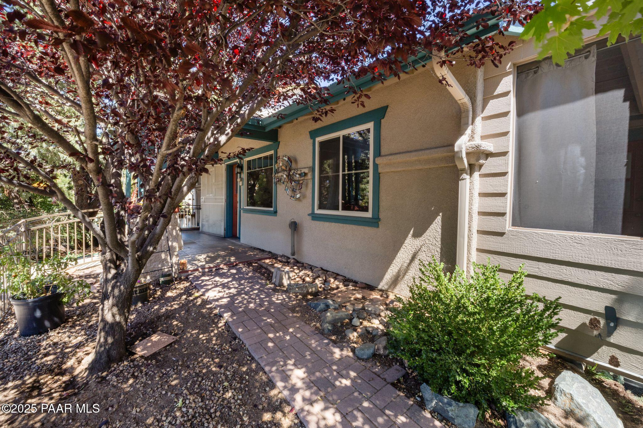 277 Jacob Lane Prescott, AZ 86303 - Photo 4 of 38 a front view of a house with a tree