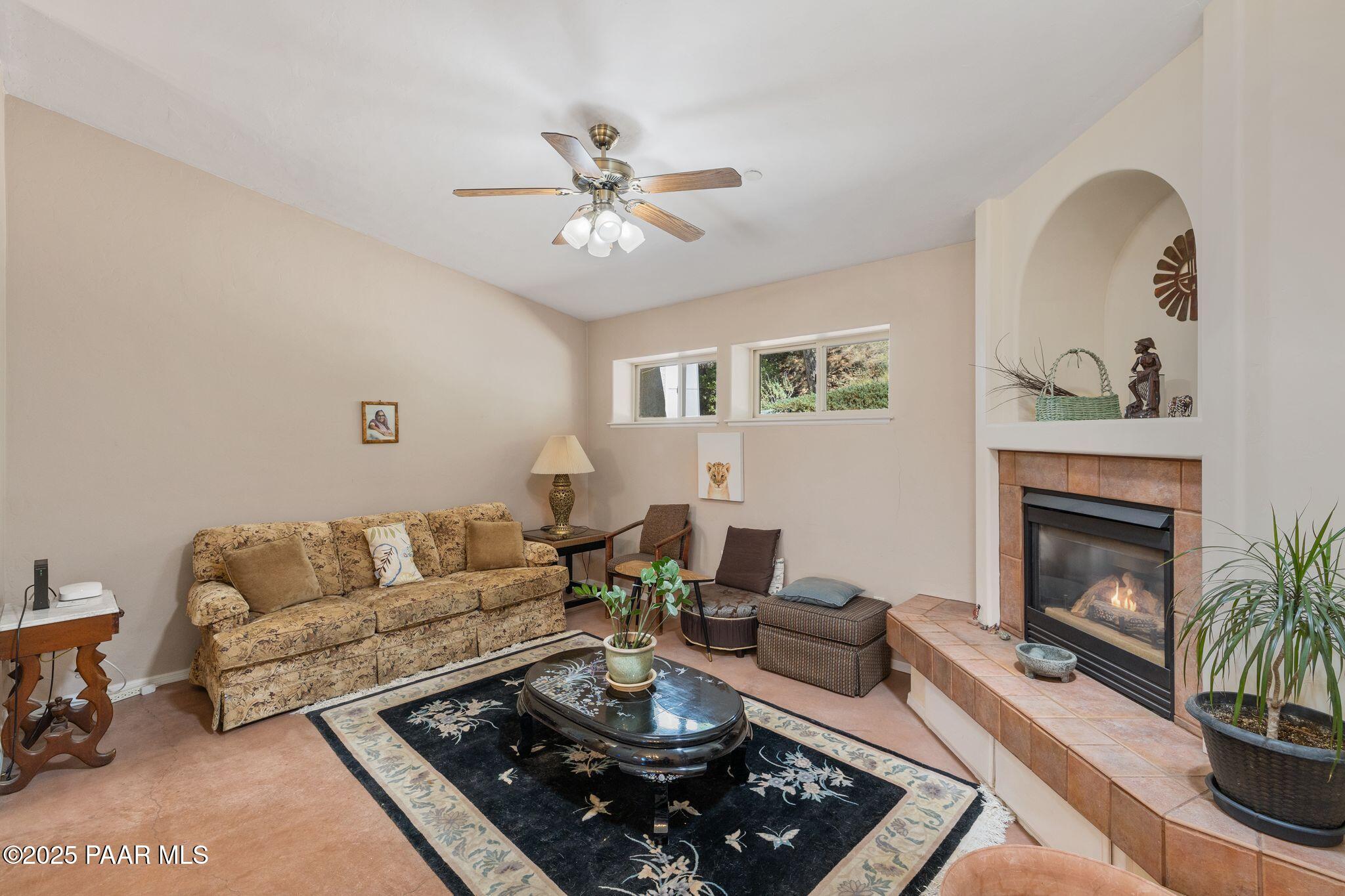 277 Jacob Lane Prescott, AZ 86303 - Photo 6 of 38 a living room with furniture and a fireplace