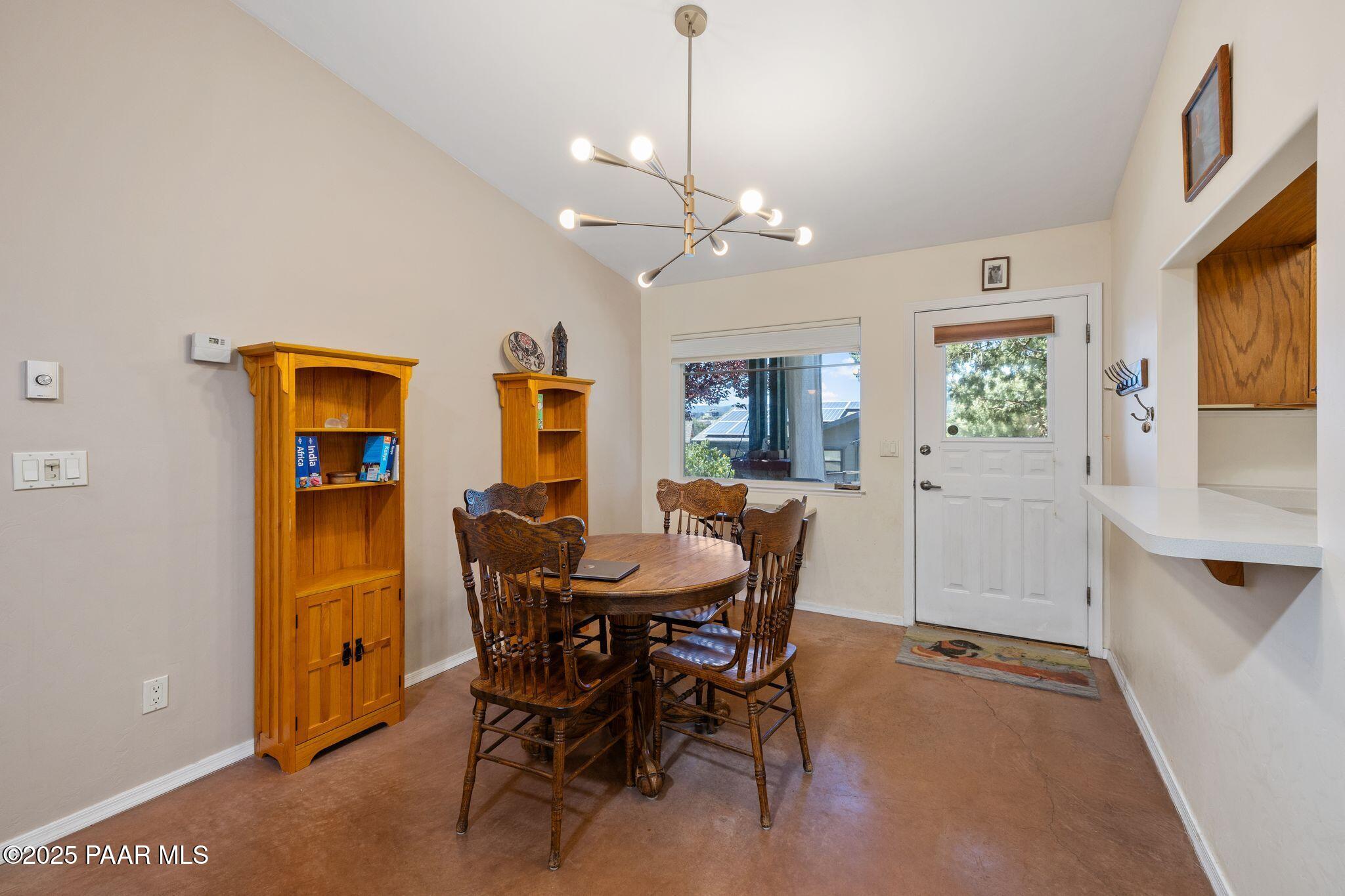 277 Jacob Lane Prescott, AZ 86303 - Photo 9 of 38 a view of a dining room with furniture and a chandelier