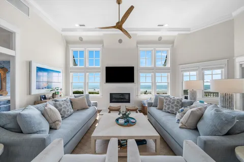 a living room with furniture fireplace and a flat screen tv