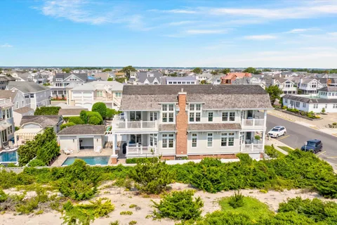 an aerial view of residential building with a garden