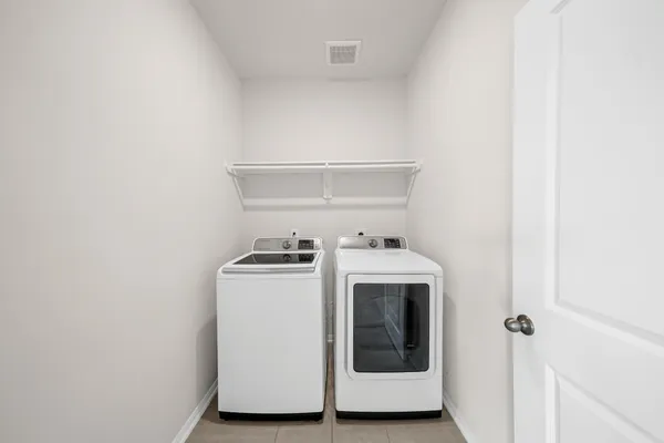 a utility room with dryer and washer