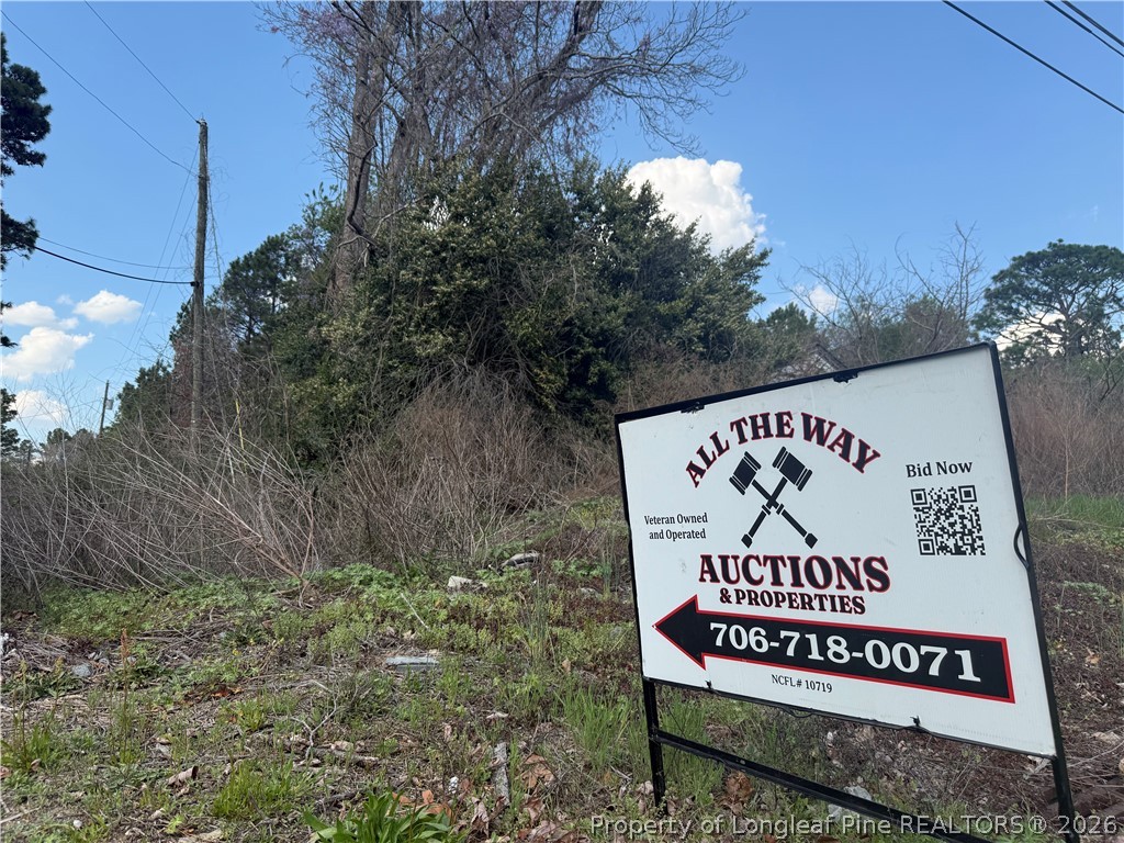 1135 Shaw Road Fayetteville, NC 28311 - Photo 7 of 8 a sign that is on the side of the road