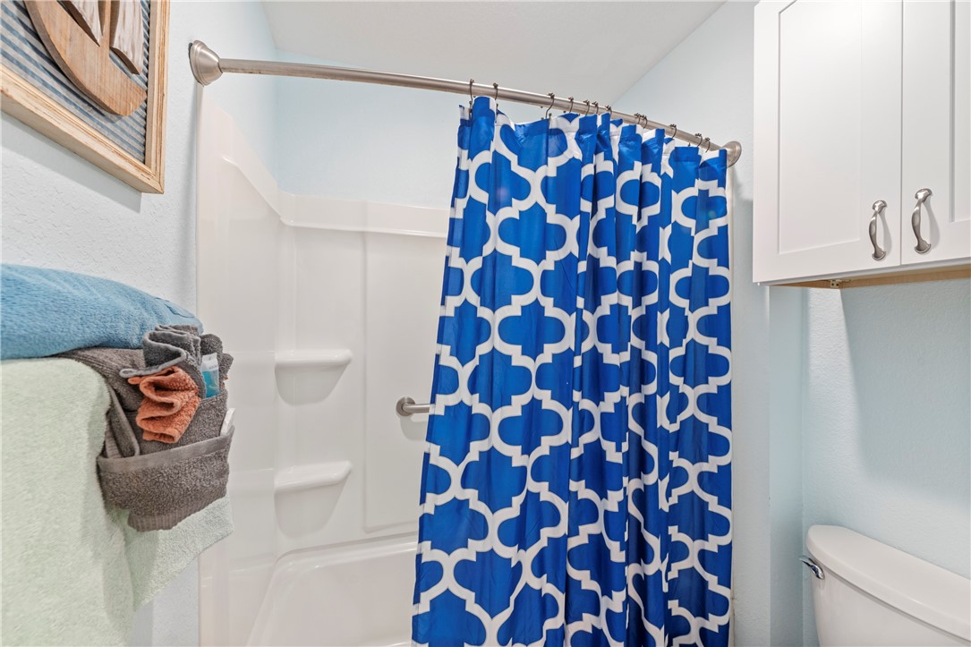 800 Beach Access Road, Unit 111 Port Aransas, TX 78373 - Photo 12 of 30 a bathroom with a shower and a sink