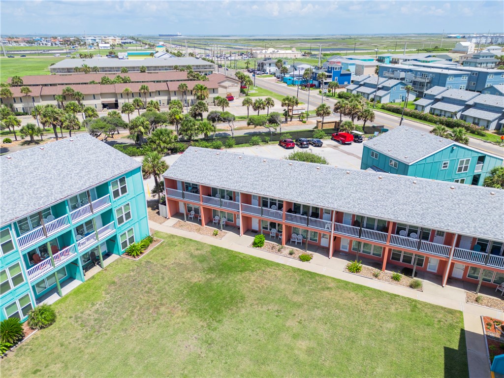 800 Beach Access Road, Unit 111 Port Aransas, TX 78373 - Photo 16 of 30 a view of a large building with a outdoor space