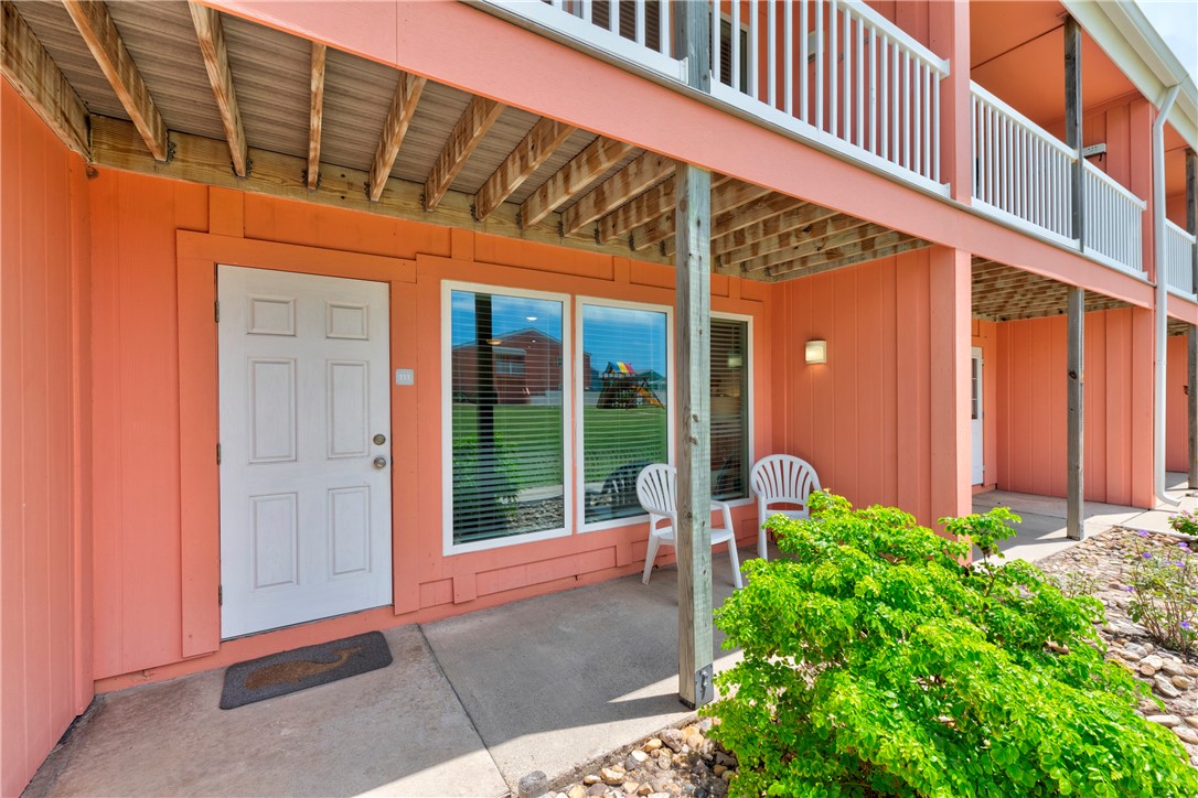 800 Beach Access Road, Unit 111 Port Aransas, TX 78373 - Photo 2 of 30 a view of porch with large windows