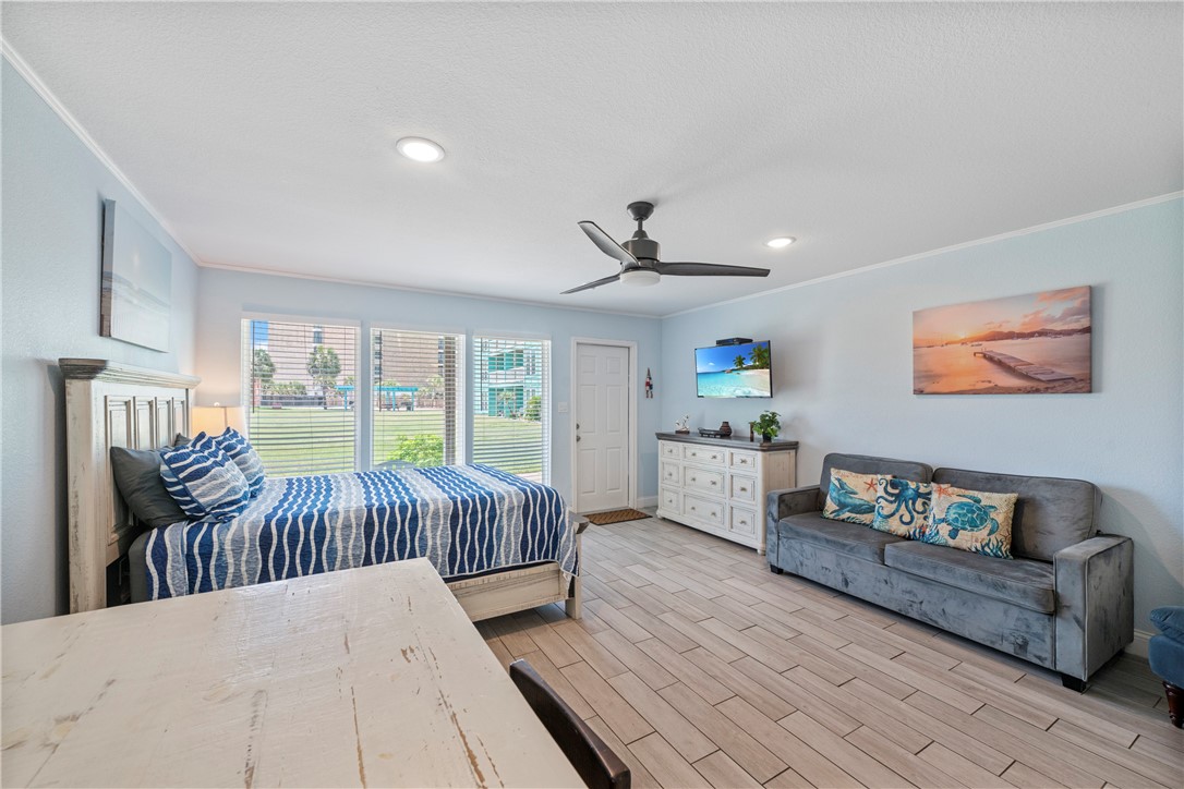 800 Beach Access Road, Unit 111 Port Aransas, TX 78373 - Photo 3 of 30 a living room with furniture and a large window