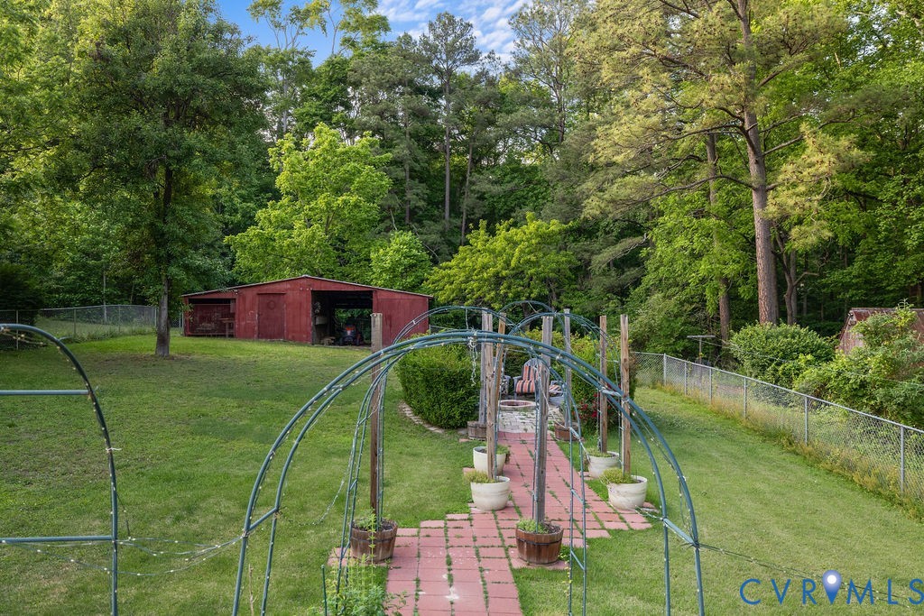 9500 West Providence Road Chesterfield, VA 23236 - Photo 14 of 21 Expansive green lawn featuring a red barn-style ou