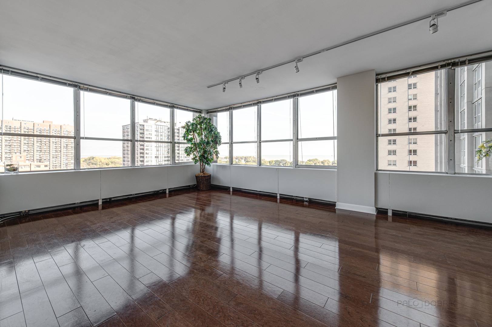 655 West Irving Park Road, Unit 1110 Chicago, IL 60613 - Photo 14 of 30 a view of an empty room with wooden floor and a window