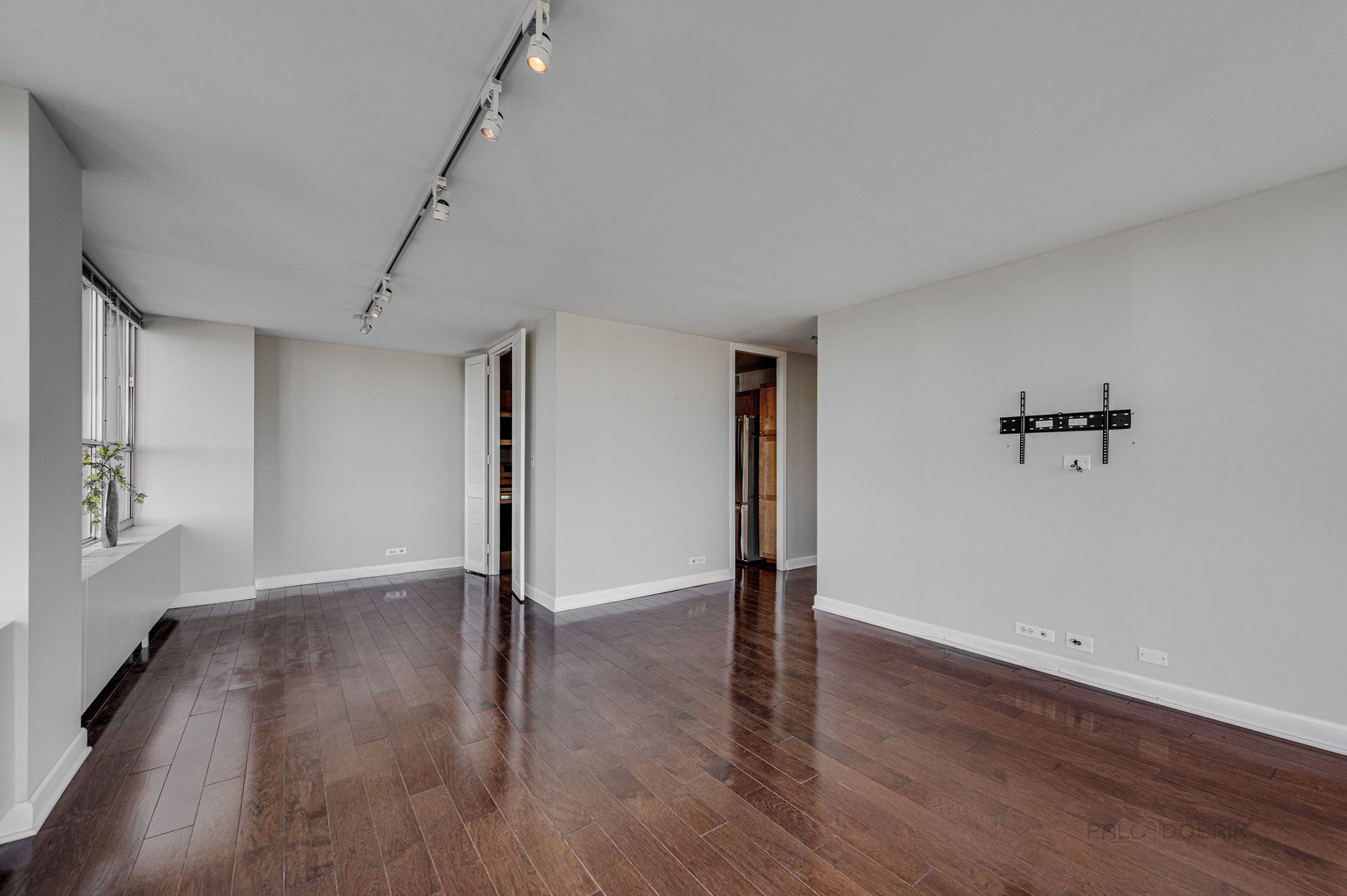 655 West Irving Park Road, Unit 1110 Chicago, IL 60613 - Photo 20 of 30 a view of an empty room with wooden floor