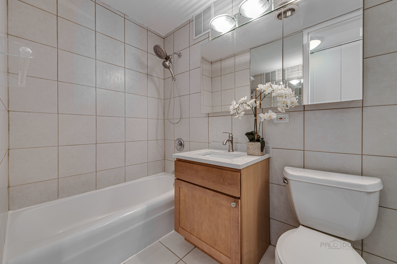 655 West Irving Park Road, Unit 1110 Chicago, IL 60613 - Photo 30 of 30 a bathroom with a sink toilet and shower