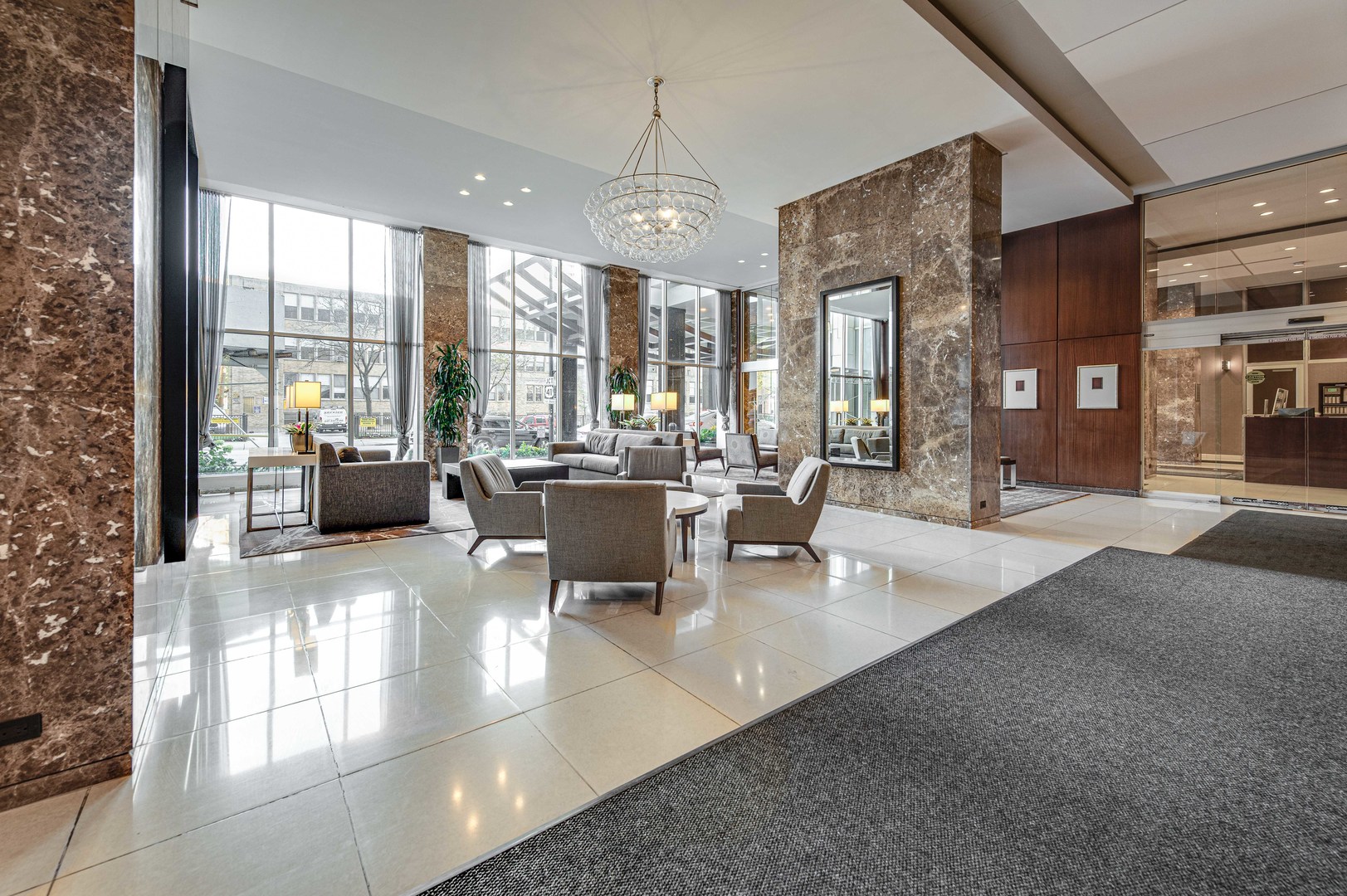 655 West Irving Park Road, Unit 1110 Chicago, IL 60613 - Photo 6 of 30 a large living room with large windows