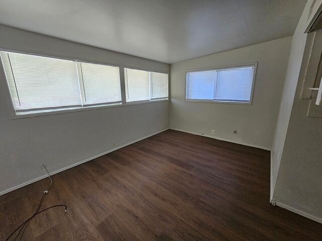 2703 66th Street Lubbock, TX 79413 - Photo 8 of 8 an empty room with wooden floor and windows