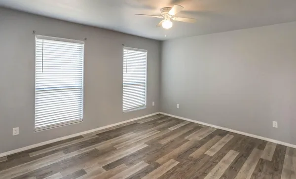 a view of an empty room with a window