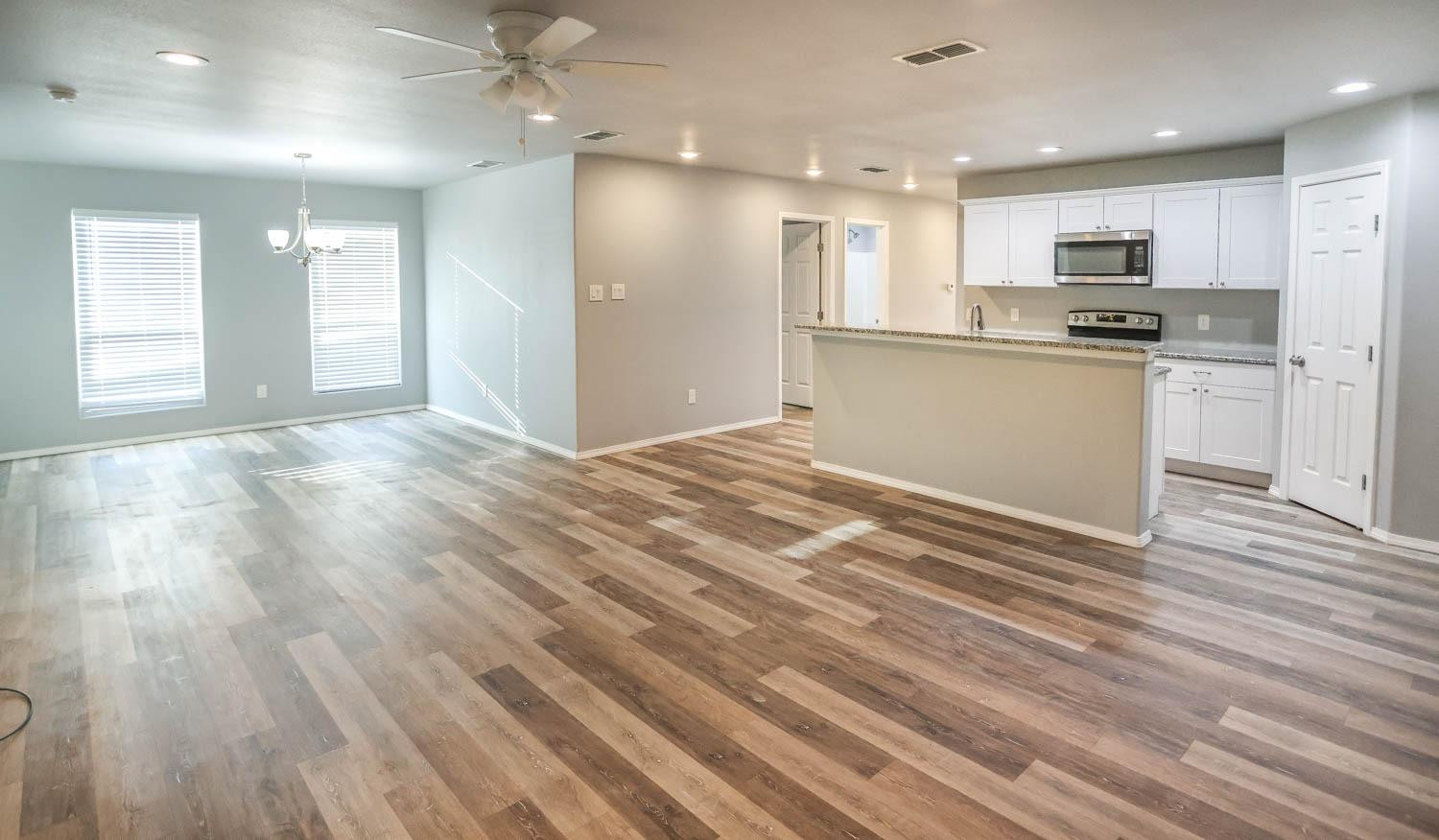 1107 North Englewood Avenue Lubbock, TX 79416 - Photo 5 of 16 a view of kitchen with kitchen island wooden floors appliances and cabinets