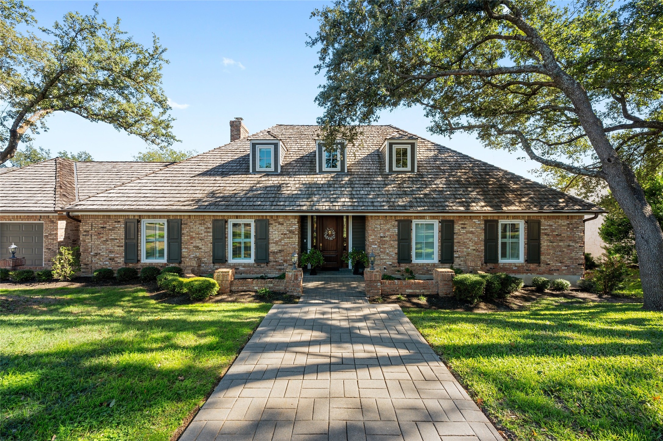 3401 Riva Ridge Road Austin, TX 78746 - Photo 1 of 1 a front view of house with yard and green space