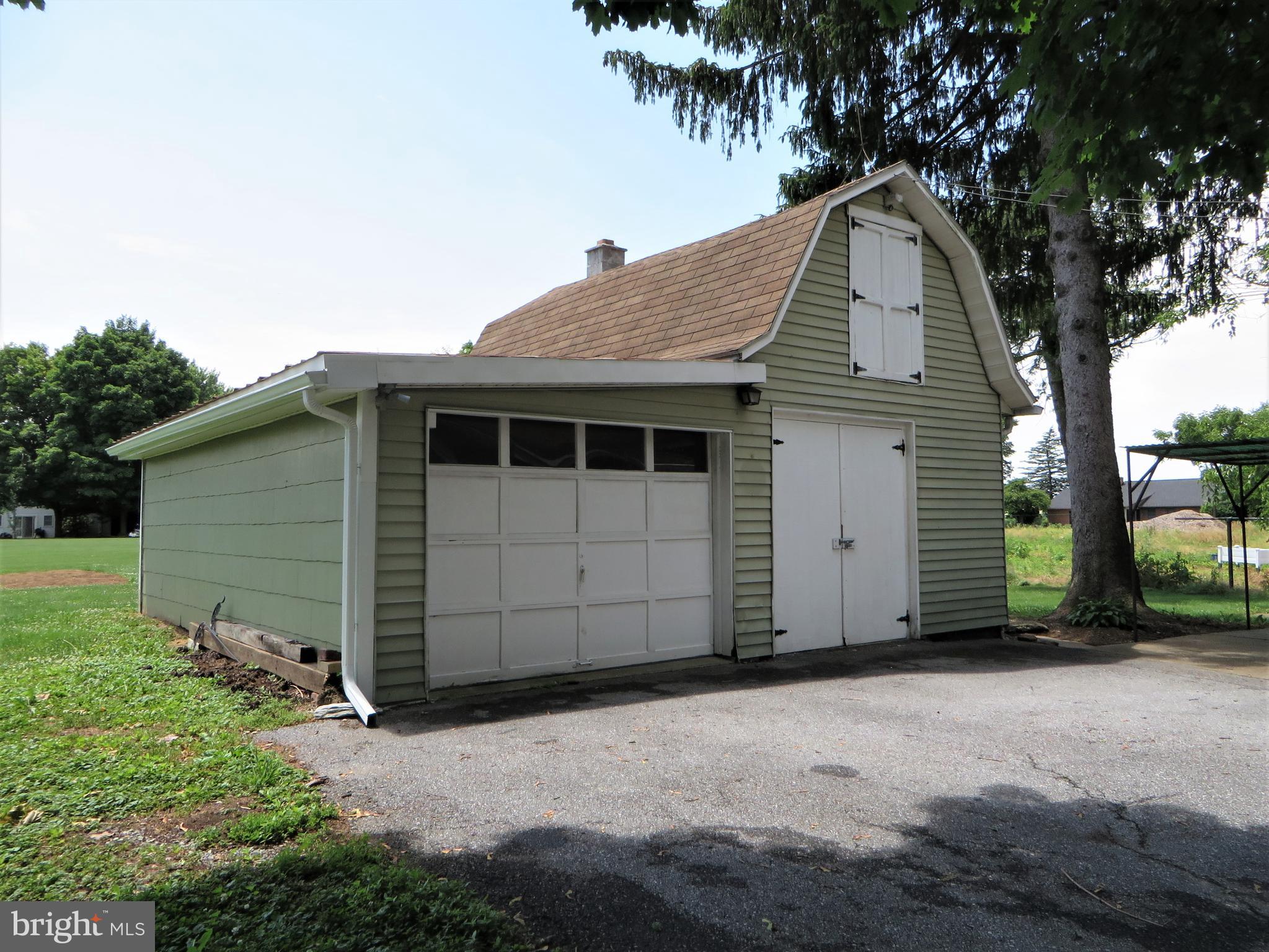 110 Race Street Lititz, PA 17543 - Photo 5 of 25 a front view of a house with a yard and garage