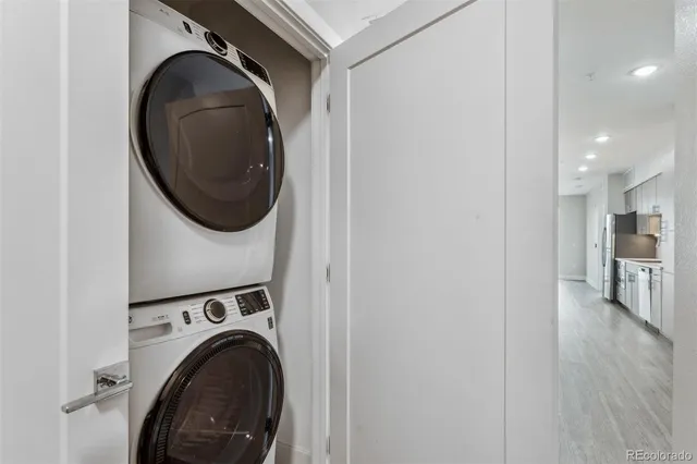 a view of a hallway with washer and dryer