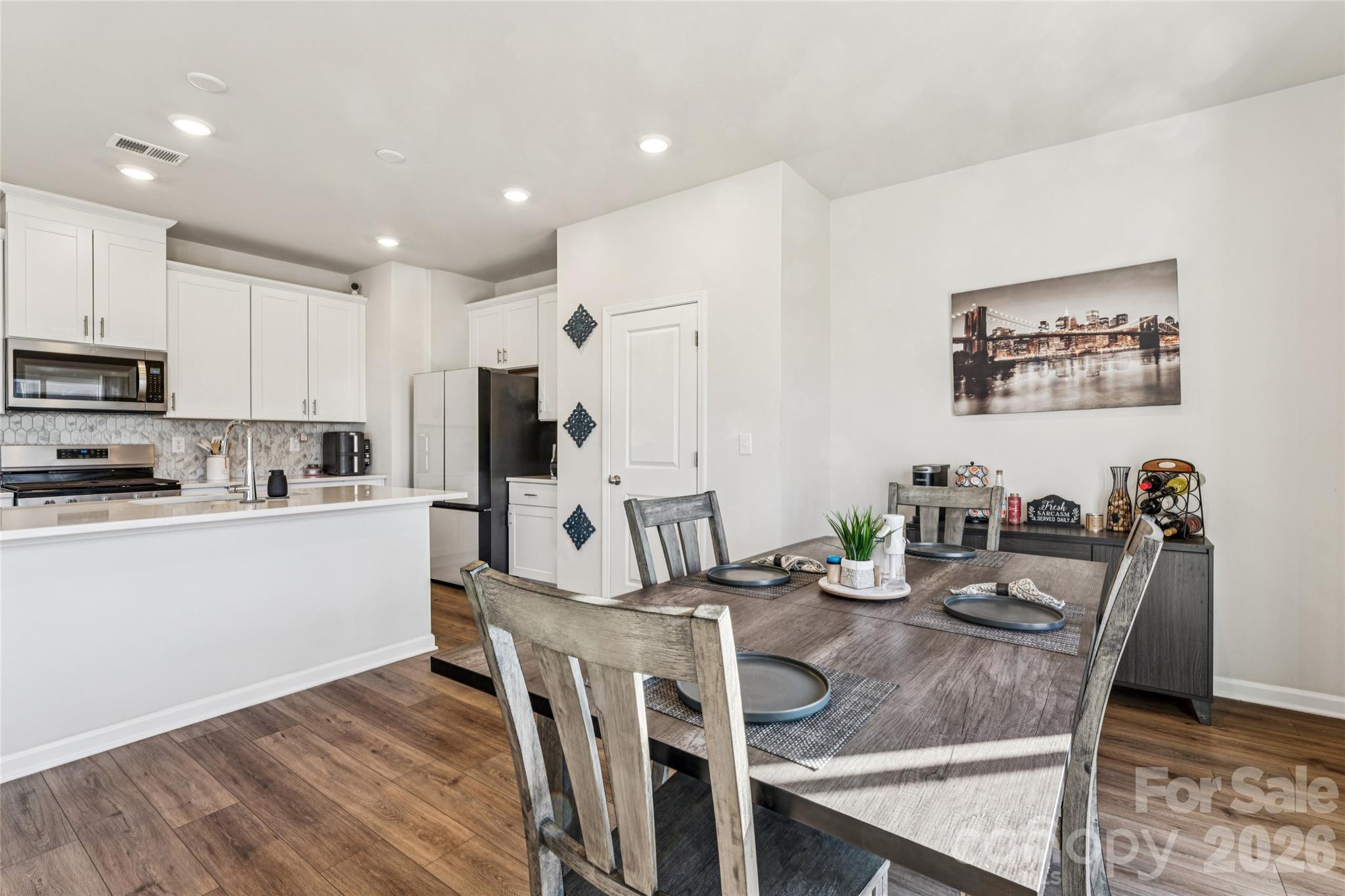 309 Olympia Way York, SC 29745 - Photo 12 of 46 a kitchen with granite countertop white cabinets and stainless steel appliances