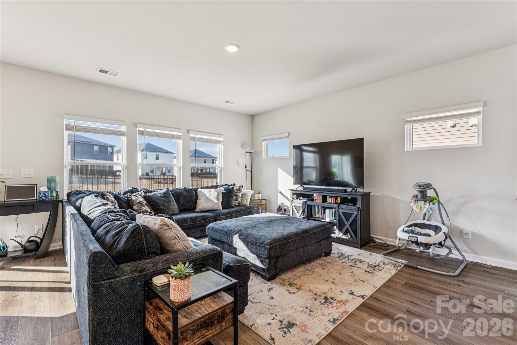 309 Olympia Way York, SC 29745 - Photo 17 of 46 a living room with furniture a flat screen tv and a window