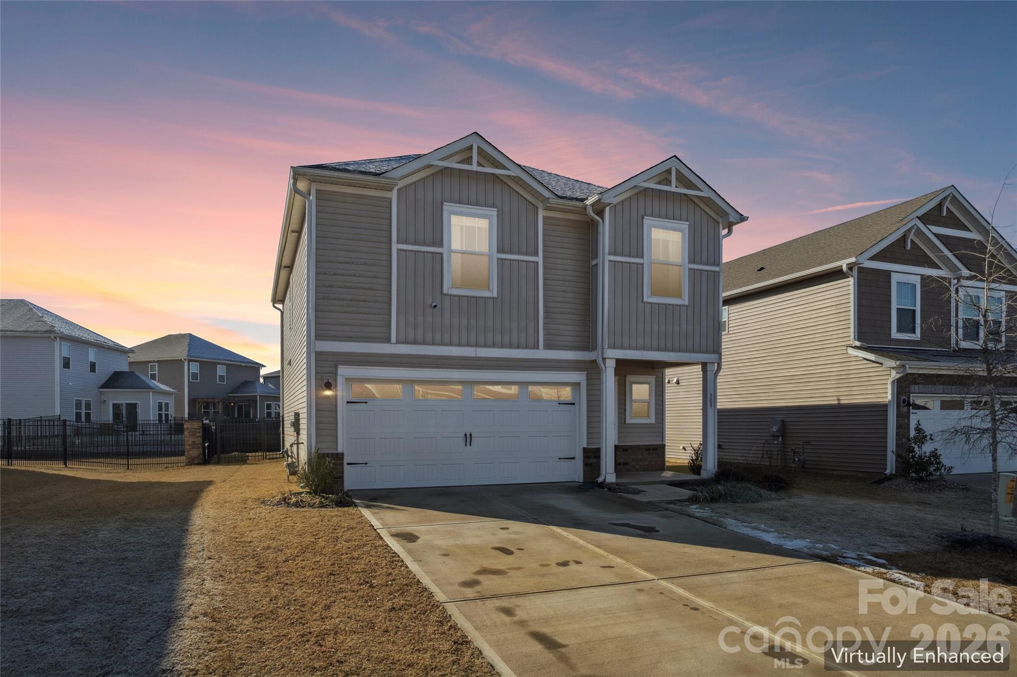 309 Olympia Way York, SC 29745 - Photo 2 of 46 a front view of a house with a yard