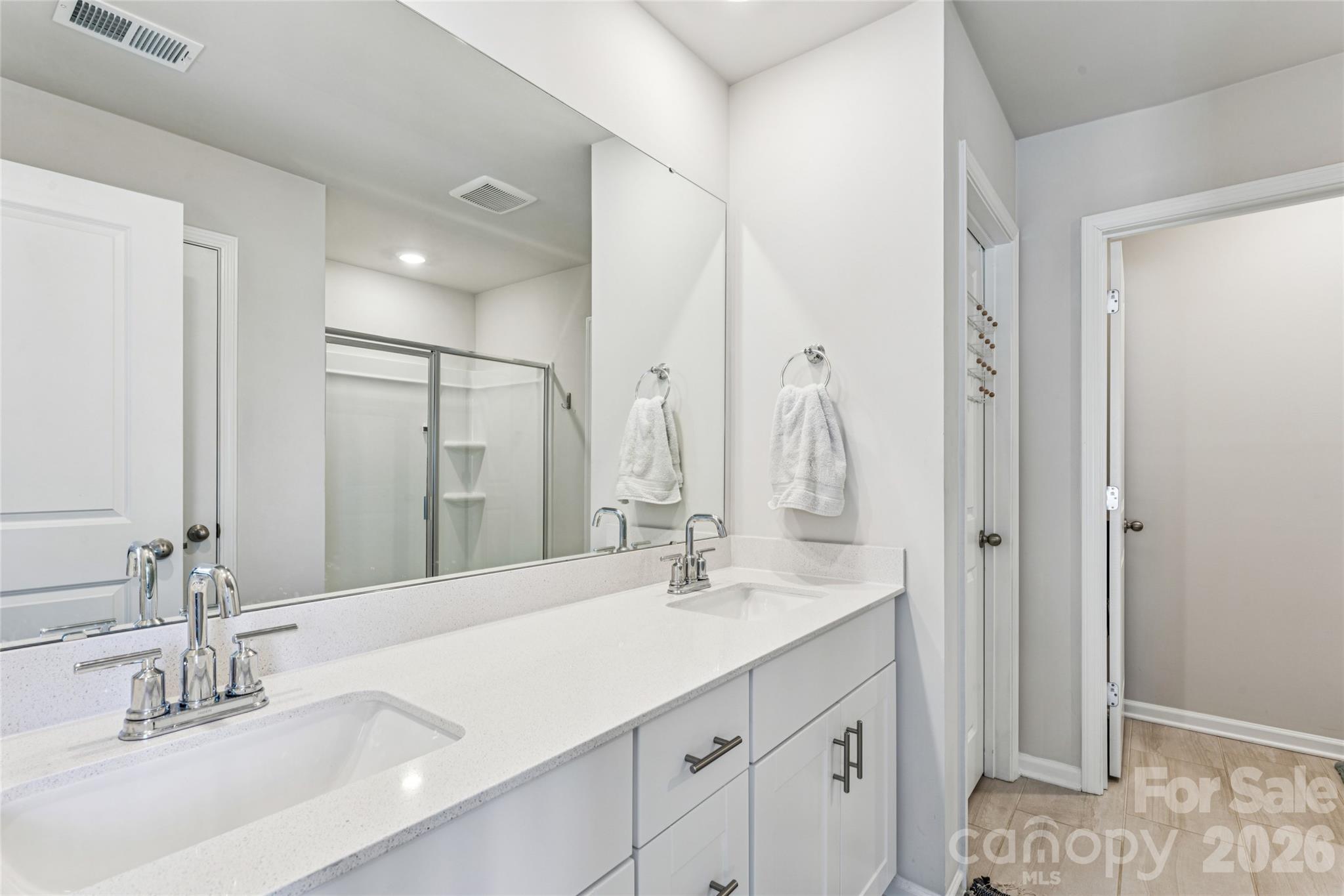 309 Olympia Way York, SC 29745 - Photo 25 of 46 a bathroom with double vanity sink and a mirror